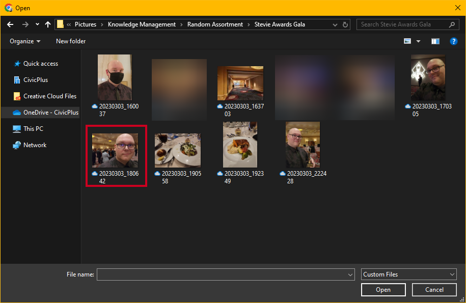 A system file explorer window opens to let you find your image.